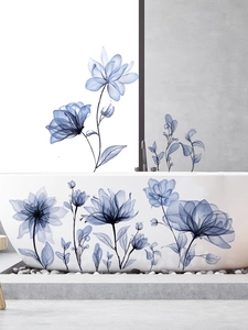 Detail of blue X-ray style flower wall stickers on bathtub and grey bathroom wall decor