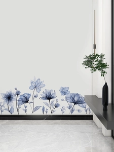 Detailed view of dark blue indigo watercolor flower wall decals in a modern living room