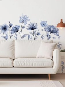Detail of blue translucent floral wall stickers in a modern minimalist living room