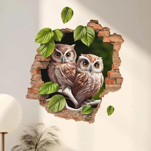 3D Eulen Wandtattoo mit grünen Blättern durch eine realistische kaputte Ziegelwand