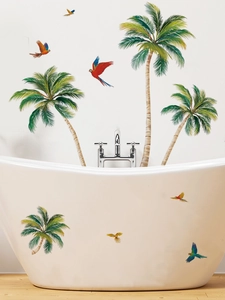 Detail of tropical coconut trees and colorful parrot wall stickers on a white bathtub