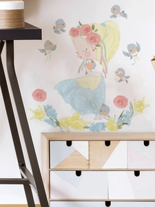 Detailed view of fairy girl wall stickers with pink floral wreath and birds on bedroom wall