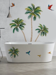 Detail of tropical palm trees and colorful parrot stickers on a modern bathroom wall