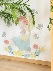 Detail of cartoon girl and blue birds wall sticker on white wall with wood floor