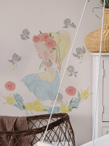 Detail of fairy girl wall decal with rose wreath and birds in nursery room decor
