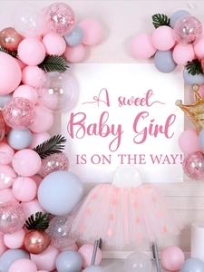 Detailed setup of Baby Girl shower decor with pink tulle tutu and festive balloons