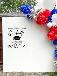 Outdoor graduation party backdrop with Class of 2025 stickers and colorful balloons