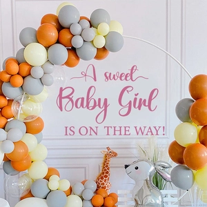 Baby shower party balloon arch set with orange and grey latex balloons for gender reveal decor