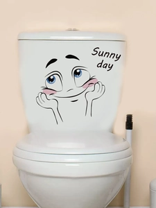 Détail macro du sticker Sunny day sourire sur la surface du réservoir de toilette