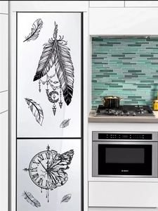 Artistic black feather and dreamcatcher wall stickers on a modern white refrigerator