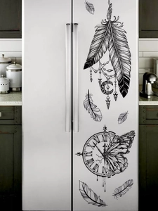 Close-up of black feather and Roman numeral clock vinyl wall decals on a white fridge