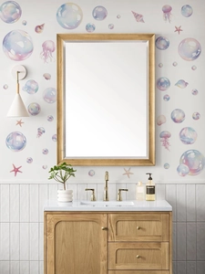 Close-up of ocean wall stickers with watercolor bubbles and jellyfish in a bathroom