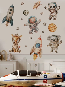 Detail of cartoon astronaut animals and planets wall stickers in a kids bedroom