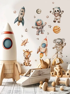 Space themed wall stickers with watercolor animals, rockets, and planets for nursery decor