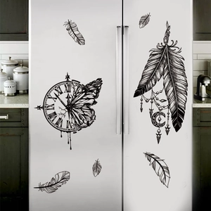 Black vinyl wall decal featuring a creative clock butterfly and bohemian feathers on a fridge