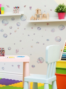 Detail of colorful bubble shell wall decals with jellyfish in ocean nursery scene