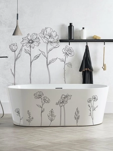 Minimalist black line floral wall decals applied to a modern bathtub for bathroom decor
