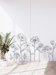 Detail of minimalist black line floral wall stickers with rose patterns on a white wall