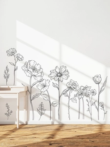 Detail of minimalist black line flower wall stickers featuring cosmos and roses