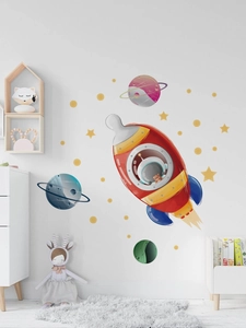 Sticker mural espace avec fusée, planètes et étoiles, détail de chambre d'enfant