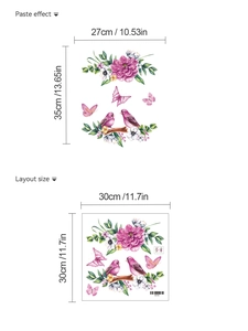 Detail view of pink flower wall stickers with birds and butterflies showing layout dimensions