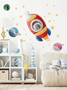 Détail de stickers muraux fusée et planètes colorées pour une chambre d'enfant douillette