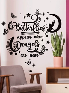Detail of PVC wall sticker with angel quote and black butterflies in living room decor