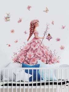 Detail of pink floral dress girl wall decal with butterflies in a cozy nursery room