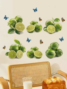 Detail of realistic green lemon and colorful butterfly wall stickers in a cozy dining room