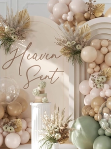 Heaven Sent party wall decals with balloons, palm leaves, and arch backdrop decoration