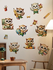 Detailed view of colorful cartoon owl classroom wall stickers in a cozy study room setting
