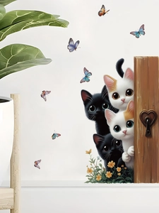 Detail of cute cartoon cat wall stickers with butterflies and floral home decor elements