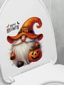 Detail of Halloween gnome wall sticker with pumpkin on white toilet lid surface