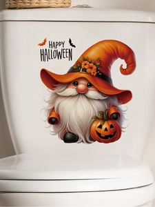 Detail of cute gnome with pumpkin sticker on white bathroom toilet tank for Halloween