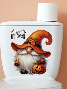 Detail of Happy Halloween gnome sticker with pumpkin on a white toilet tank
