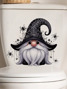 Close-up of Halloween gnome decal with spider web hat on a white bathroom surface