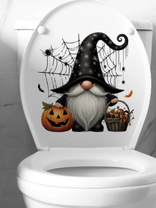 Detail of Halloween gnome sticker with pumpkin and spider web on white toilet cover