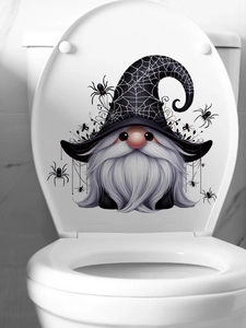 Detail showing a Halloween gnome toilet sticker with spider webs and hanging spiders decor