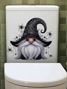 Detail of Halloween gnome wizard sticker with white beard and spiders on a white surface