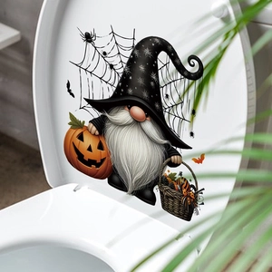 Halloween gnome wall decal featuring a pumpkin lantern on a white toilet lid cover