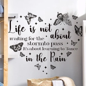 Black inspirational wall sticker featuring Life is not about waiting for the storm quote
