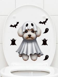 Detail of Halloween ghost puppy toilet lid sticker with black bats on white ceramic surface