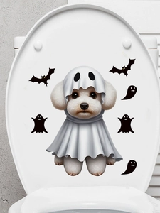 Detail of cute ghost puppy and bat stickers on a white toilet lid for Halloween decor