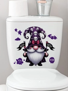 Close-up of Halloween gnome sticker with purple hat and BOO sign on white toilet tank