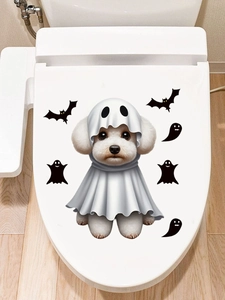 Close-up of Halloween ghost dog and bat toilet stickers applied on white bathroom lids