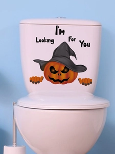 Close-up of Halloween pumpkin sticker with witch hat and I'm Looking For You text