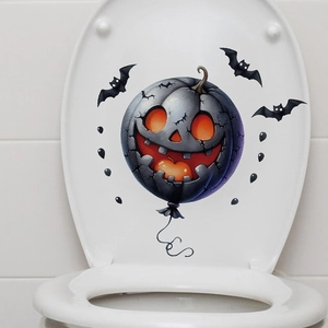 Halloween toilet seat decal featuring a glowing Jack-O-Lantern pumpkin and black bats