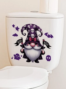 Detail of Halloween gnome sticker with purple hat and BOO flag on white toilet tank