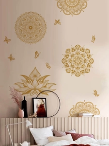 Detailed golden mandala and lotus flower wall decals displayed in a modern bedroom setup