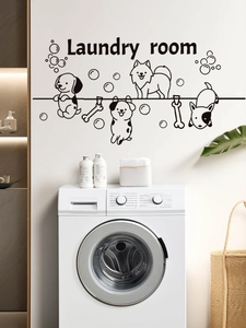 Close-up of Laundry Room wall sticker with cartoon puppies and bold lettering in modern home